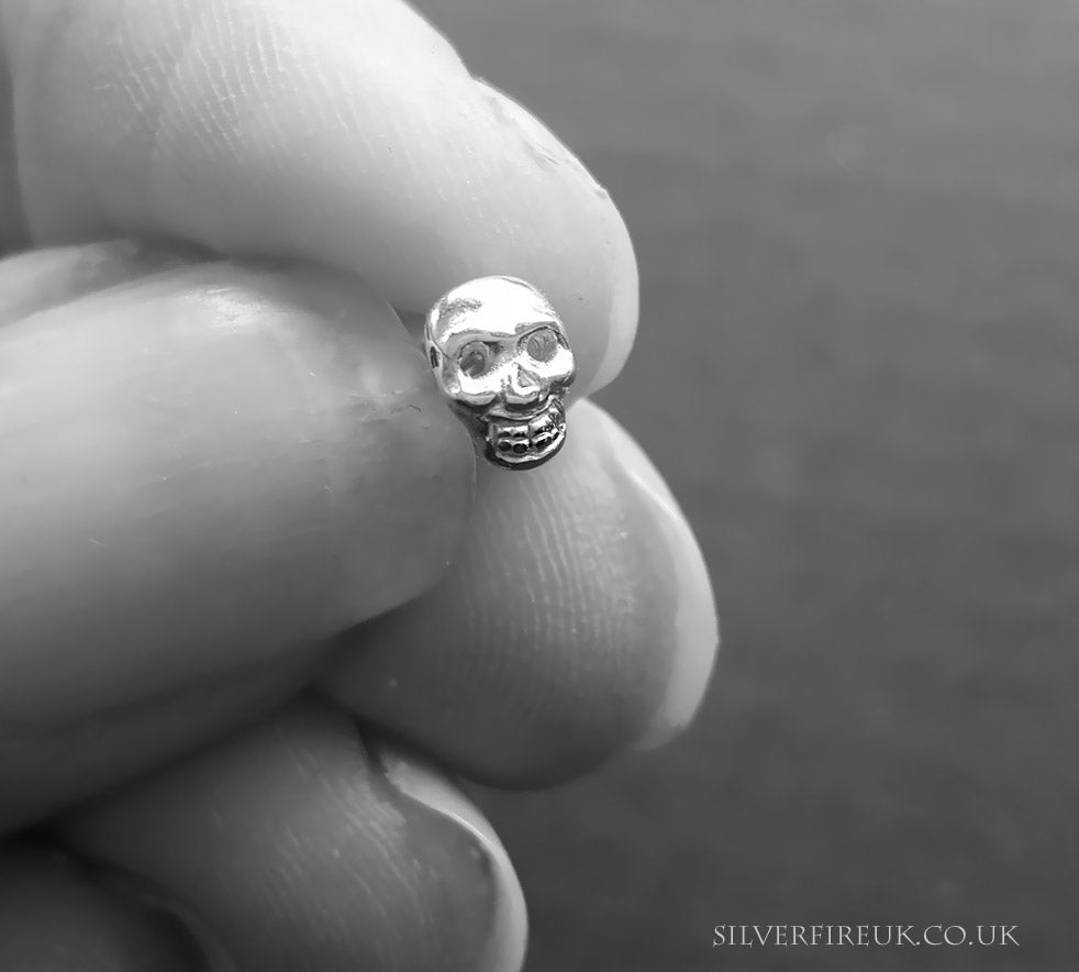 Sterling silver skull hot sale stud earrings